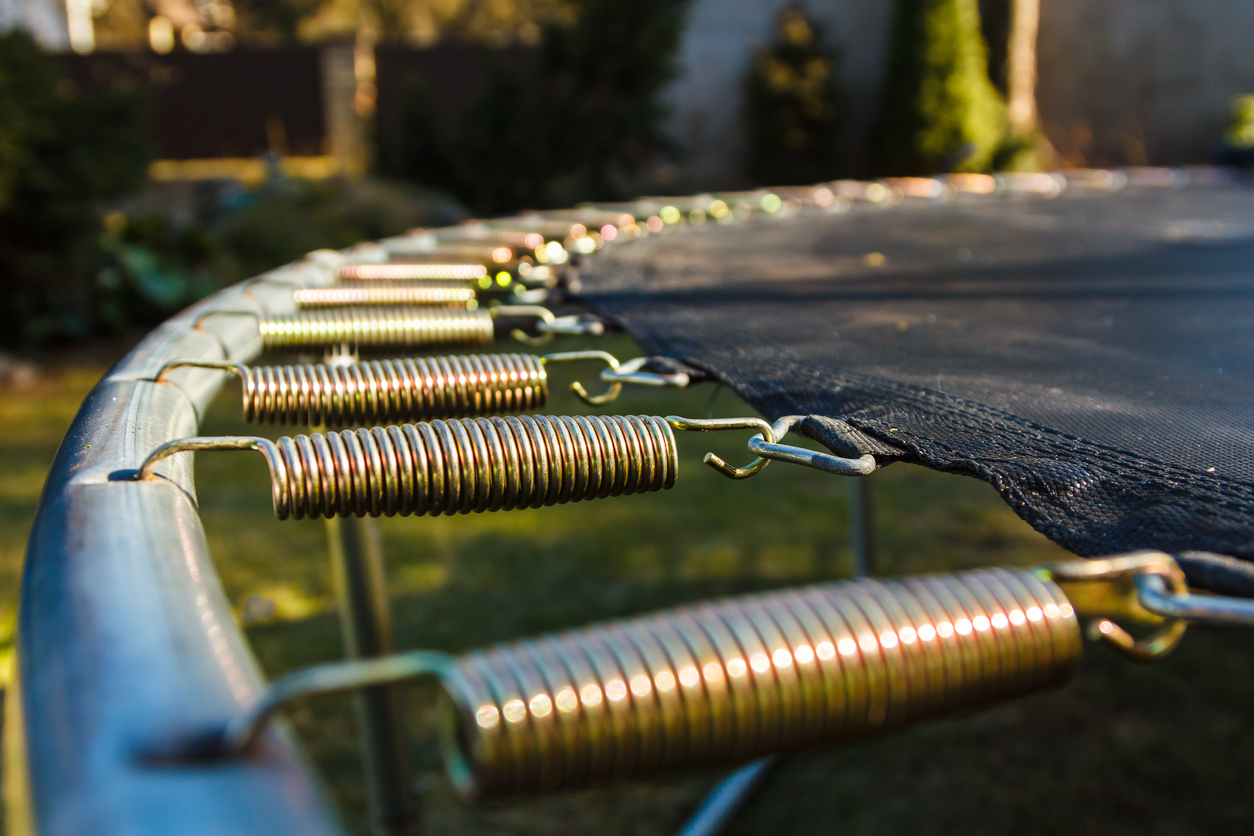 springs attached to the trampoline frame