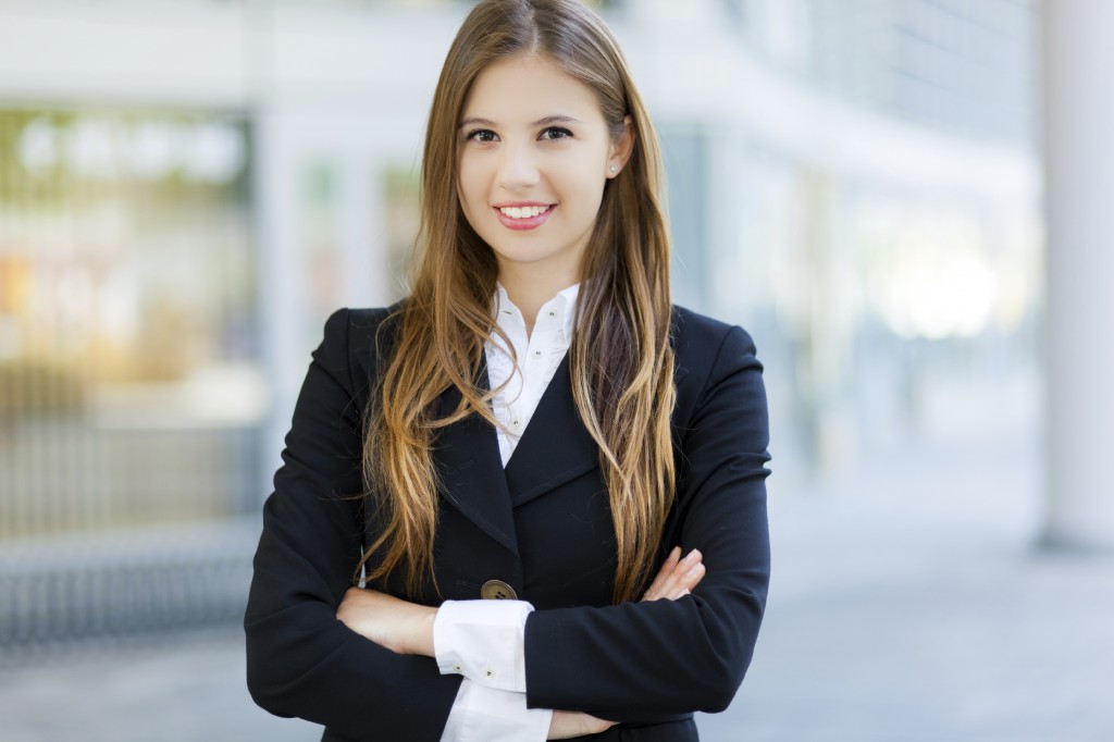 Smiling businesswoman in urban setting