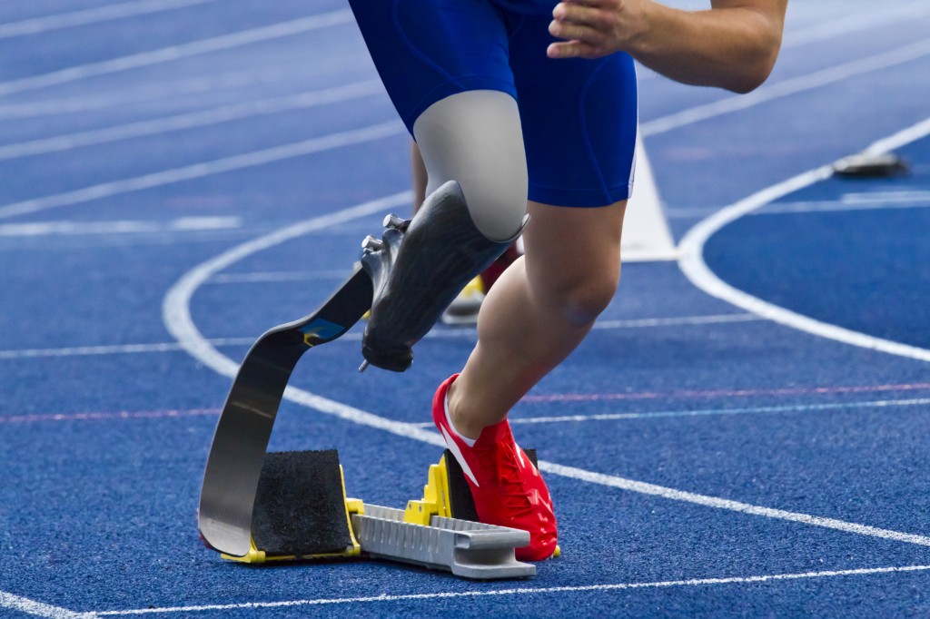 Handicapped sprinter on blue track