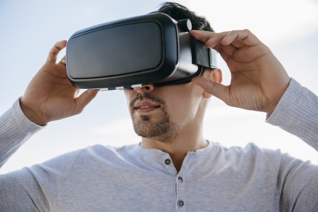 Young Man Using Virtual Glasses