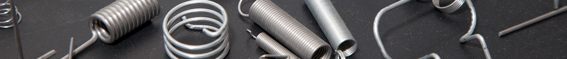 selection of springs on a grey background in a banner image