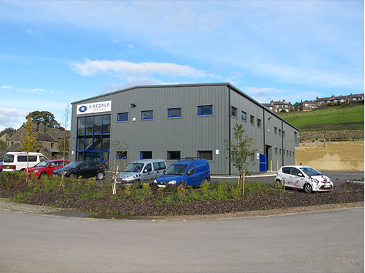 airedale springs manufacturing plant with blue sky in the backgrouond