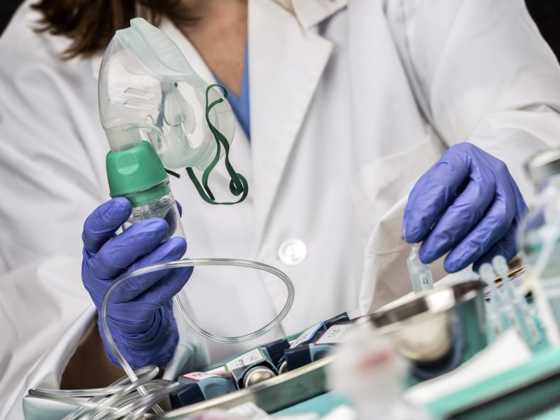 Nurse prepares oxygen mask in hospital