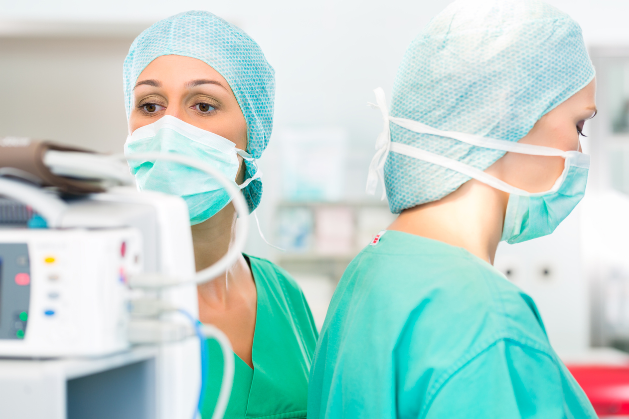 Surgeons operating patient in operation theater