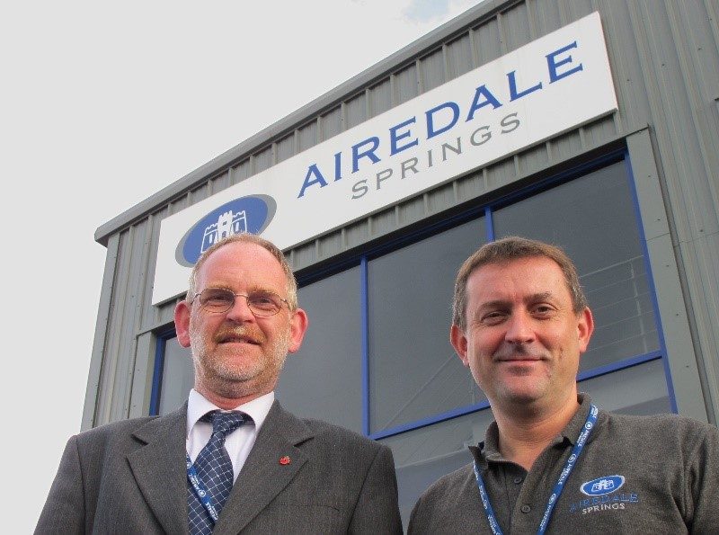 Airedale springs chairman and colleague stood outside manufacturing facility